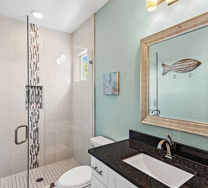 Private ensuite bathroom with a spacious vanity and walk-in shower for added comfort and convenience.