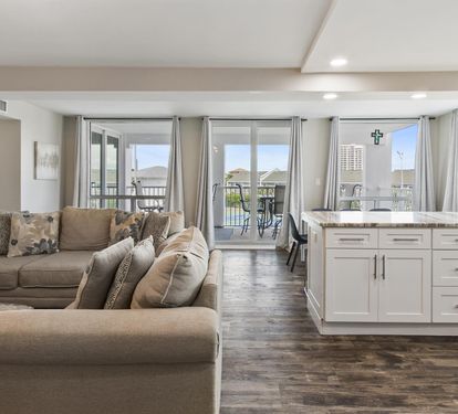 Unwind in your bright open-plan living space with plush seating and a modern kitchen that flows seamlessly to your private balcony.