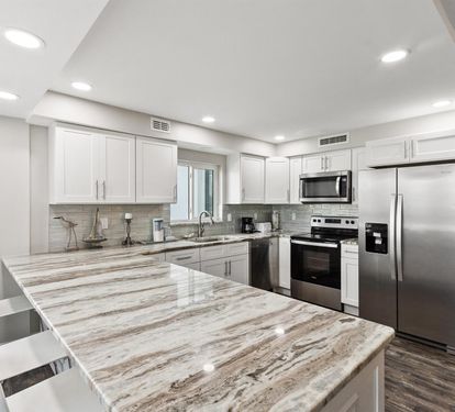 Your fully equipped kitchen features modern appliances, marble countertops, and ample space for preparing memorable meals during your stay.