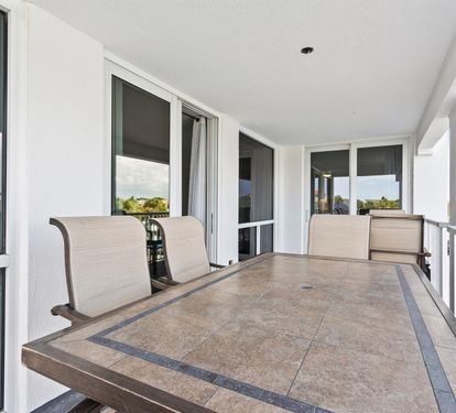 Relax on your private balcony with comfortable seating and stunning views stretching across the neighborhood.