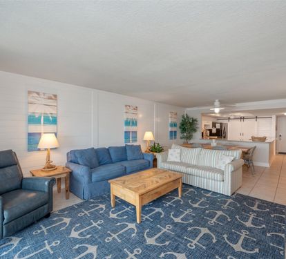 Relax in your coastal-themed living room with plush seating and nautical touches that perfectly capture beachside charm.