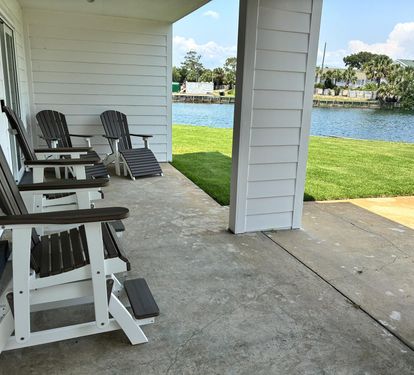 Relax in your waterfront chairs while watching boats drift by on the sparkling canal just steps from your door.