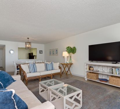 Your bright, coastal-inspired living space features comfortable seating and modern amenities for relaxing after your beach adventures.
