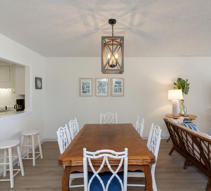 Gather around your elegant dining table while staying connected to the kitchen - perfect for memorable meals and conversations.
