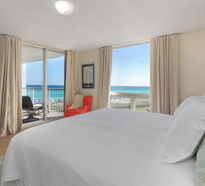 Wake up to stunning turquoise waters through floor-to-ceiling windows. Your beachfront bedroom offers the perfect blend of comfort and breathtaking ocean views.