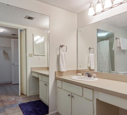Your spacious bathroom features dual sinks and ample counter space, with fresh towels and everything you need for a comfortable stay.