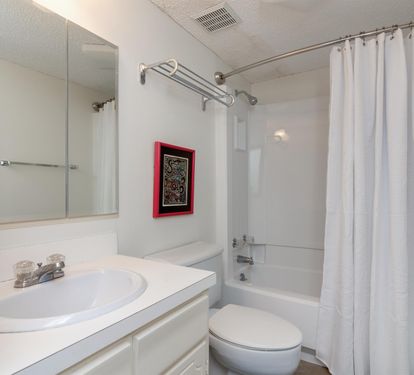 Step into your clean, well-appointed bathroom with a relaxing tub-shower combo and fresh towels waiting for you.