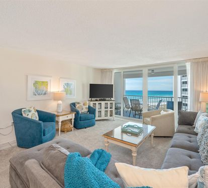 Sink into plush seating while ocean waves fill your view through floor-to-ceiling windows on your private balcony.