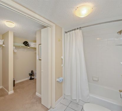 Step into your private bathroom featuring a spacious tub-shower combo and convenient walk-in closet for all your belongings.