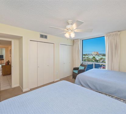 Wake up to stunning water views from your comfortable twin beds, with plenty of storage and natural light streaming through.