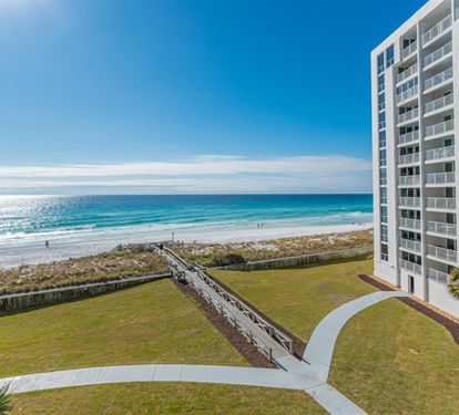 Modern beachfront property with direct beach access and stunning ocean views from this Gulf Coast location.