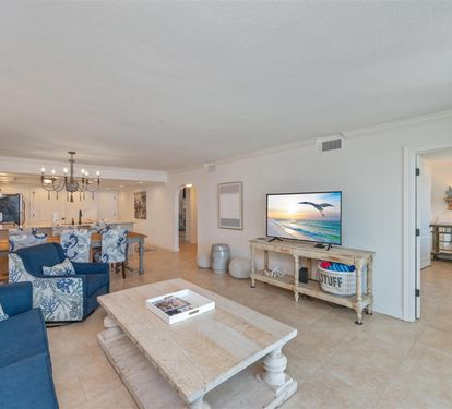 Unwind in this bright, open living space where coastal blues and whites create your perfect beach getaway atmosphere.