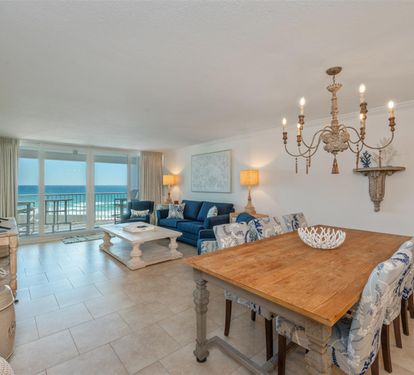 Relax in your elegant oceanfront living space with stunning sea views, comfortable seating, and dining for memorable meals together.