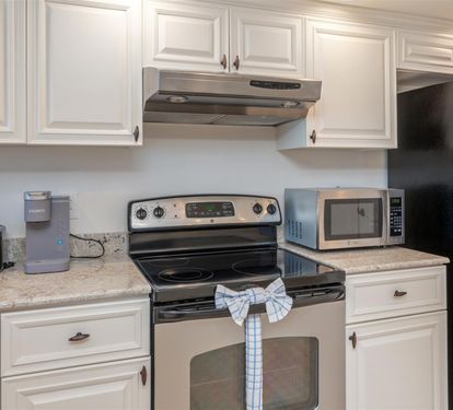 Your fully equipped kitchen features granite counters, stainless appliances, and everything needed to prepare delicious meals during your stay.