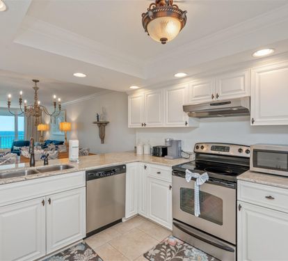 Your fully equipped kitchen with granite countertops and stunning ocean views makes preparing meals a delight.