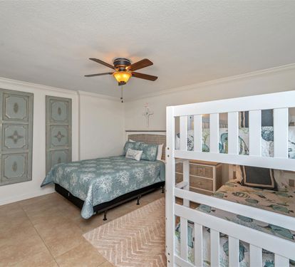 Your family bedroom features both queen and bunk beds, perfect for kids and adults to rest together comfortably.