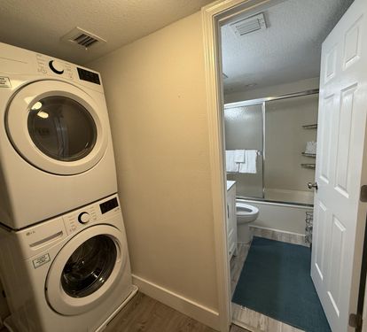 Your private laundry area keeps travel light with full-size washer and dryer, plus convenient bathroom access.