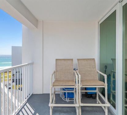Step onto your private balcony and soak up the stunning ocean breeze while relaxing in comfortable seating with breathtaking sea views.