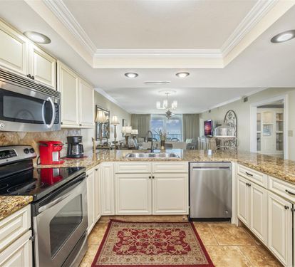 Your gourmet kitchen awaits with granite counters, stainless appliances, and plenty of space for cooking memorable meals together.