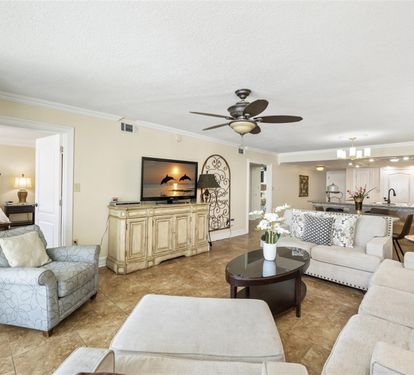 Sink into plush seating while enjoying your favorite shows on the mounted TV, with the open kitchen just steps away for snacks.