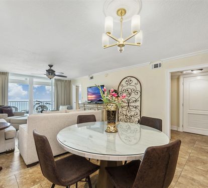 Your elegant dining area flows into the living space, perfect for memorable meals with breathtaking ocean views beyond.