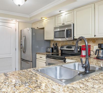 Your fully equipped kitchen features granite countertops, stainless steel appliances, and everything you need for memorable meals.