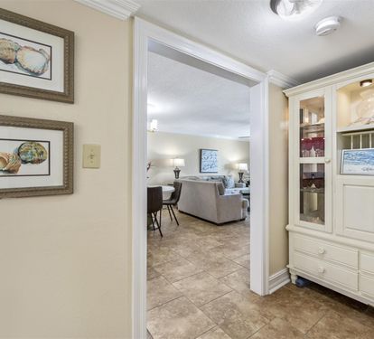 You'll love the seamless flow between your dining area and living room, with elegant built-in display cabinets to showcase your treasures.
