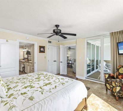 Your spacious master suite offers comfort and relaxation with a cozy seating area and private balcony access for morning coffee.