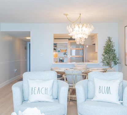 Sink into these dreamy blue chairs where coastal charm meets modern elegance. Your beach getaway begins in this stunning dining space.