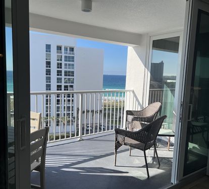 Step onto your private balcony and sink into comfortable wicker chairs while soaking up stunning ocean views and coastal breezes.