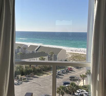 Wake up to stunning ocean views framed by soft curtains, with pristine white sand beaches just steps away from your window.
