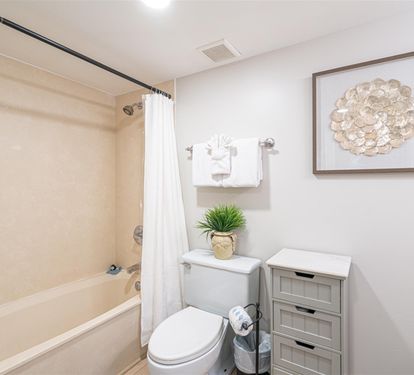 Refresh in your bright, clean bathroom featuring a full tub-shower combo and thoughtful touches for your comfort.