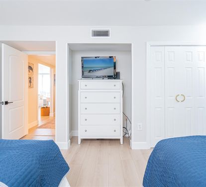 Unwind in your bright bedroom with two comfortable beds, built-in TV entertainment, and ample closet storage for all your vacation essentials.