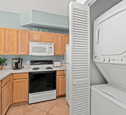 Your beach-themed kitchen comes equipped with everything you need, plus convenient in-unit washer and dryer for effortless vacation laundry.