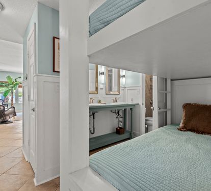 Your cozy bunk bed nook offers comfort and style, with the ensuite bathroom just steps away for ultimate convenience.