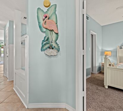 Your charming coastal retreat features playful flamingo decor and bright, airy spaces that instantly transport you to paradise.