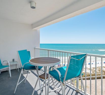 Sip your morning coffee on your private balcony while turquoise waves dance before pristine white sand.