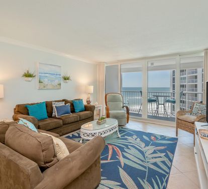 Relax in your coastal living room where ocean views meet comfortable furnishings and beachy décor.