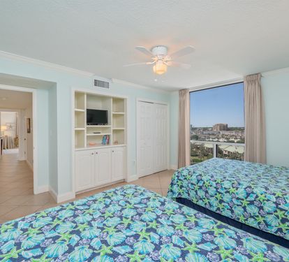 Wake up to stunning city views in your bright twin bedroom, featuring built-in entertainment center and peaceful coastal vibes.
