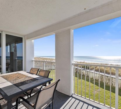 Your private balcony offers stunning oceanfront views where you can dine alfresco while watching waves meet the shore.