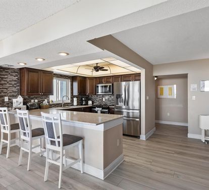 Your spacious kitchen features granite countertops, stainless steel appliances, and bar seating where you can gather for meals and conversation.