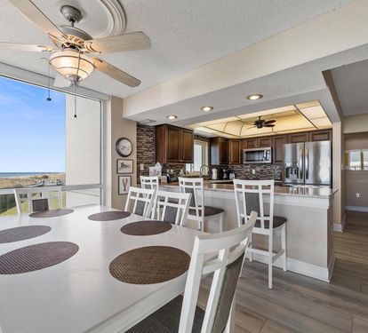 Your open-plan dining and kitchen area offers stunning ocean views while you cook and share meals together in this beautifully appointed space.