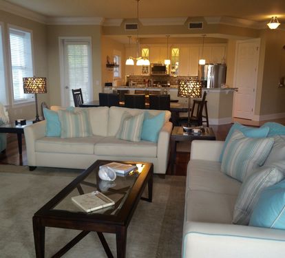 Living RM has 2 sofas & 2 accent chairs. 4 stools at the bar. Second patio also!
