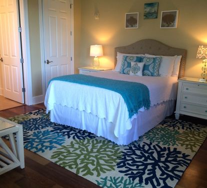 Second Master Bedroom with queen bed and sitting area.