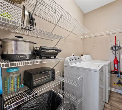 Salty Seashell Pantry Space and Laundry Room with Full Size Washer + Dryer