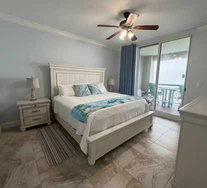 A bright, comfortable retreat with private bath access. Primary bedroom.