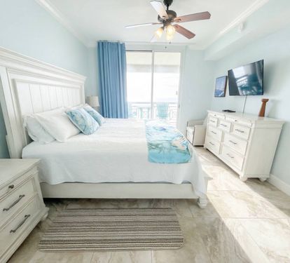 A bright, comfortable retreat with private bath access. Primary bedroom.