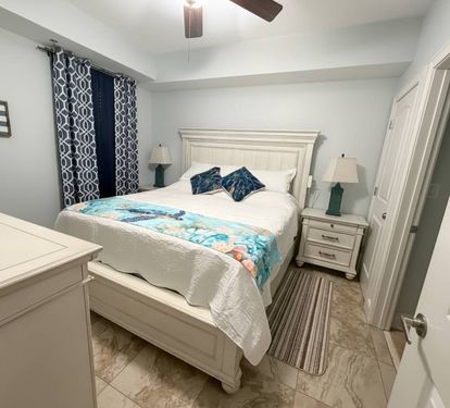 A charming guest bedroom that gives everyone their own comfortable place to recharge. King bedroom #2