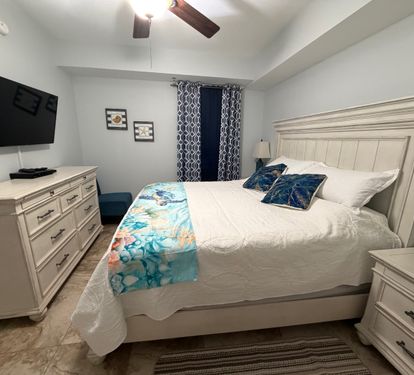 A charming guest bedroom that gives everyone their own comfortable place to recharge. King Bedroom #2