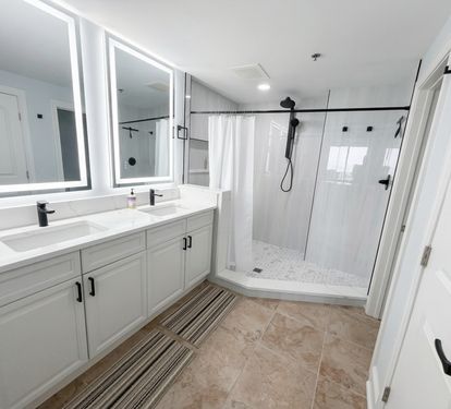 Start your day with plenty of space—double sinks, bright lighting, and a large walk-in tiled shower make mornings easy for everyone. Located off the Primary bedroom